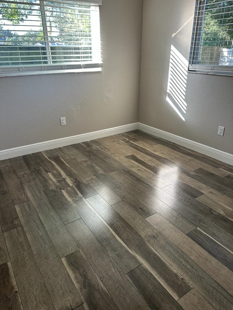 The same style of room after finishing, with bright light on the new floor